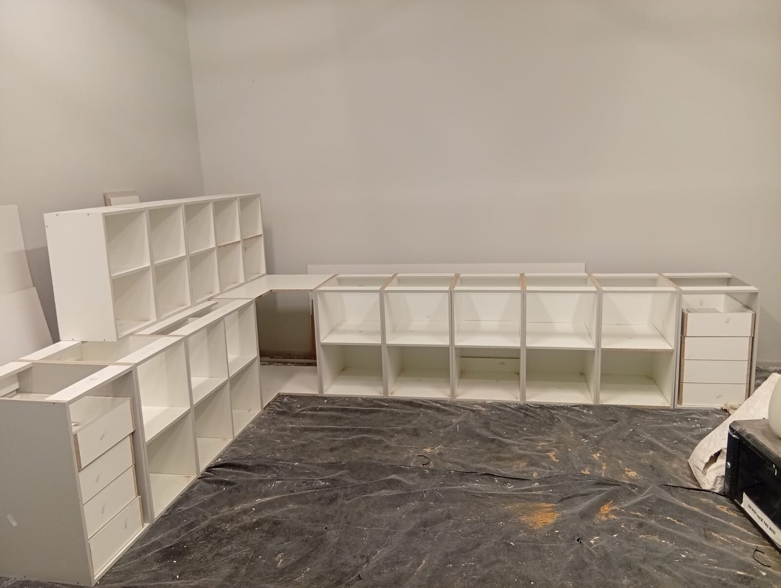 Custom cabinetry units being assembled on site