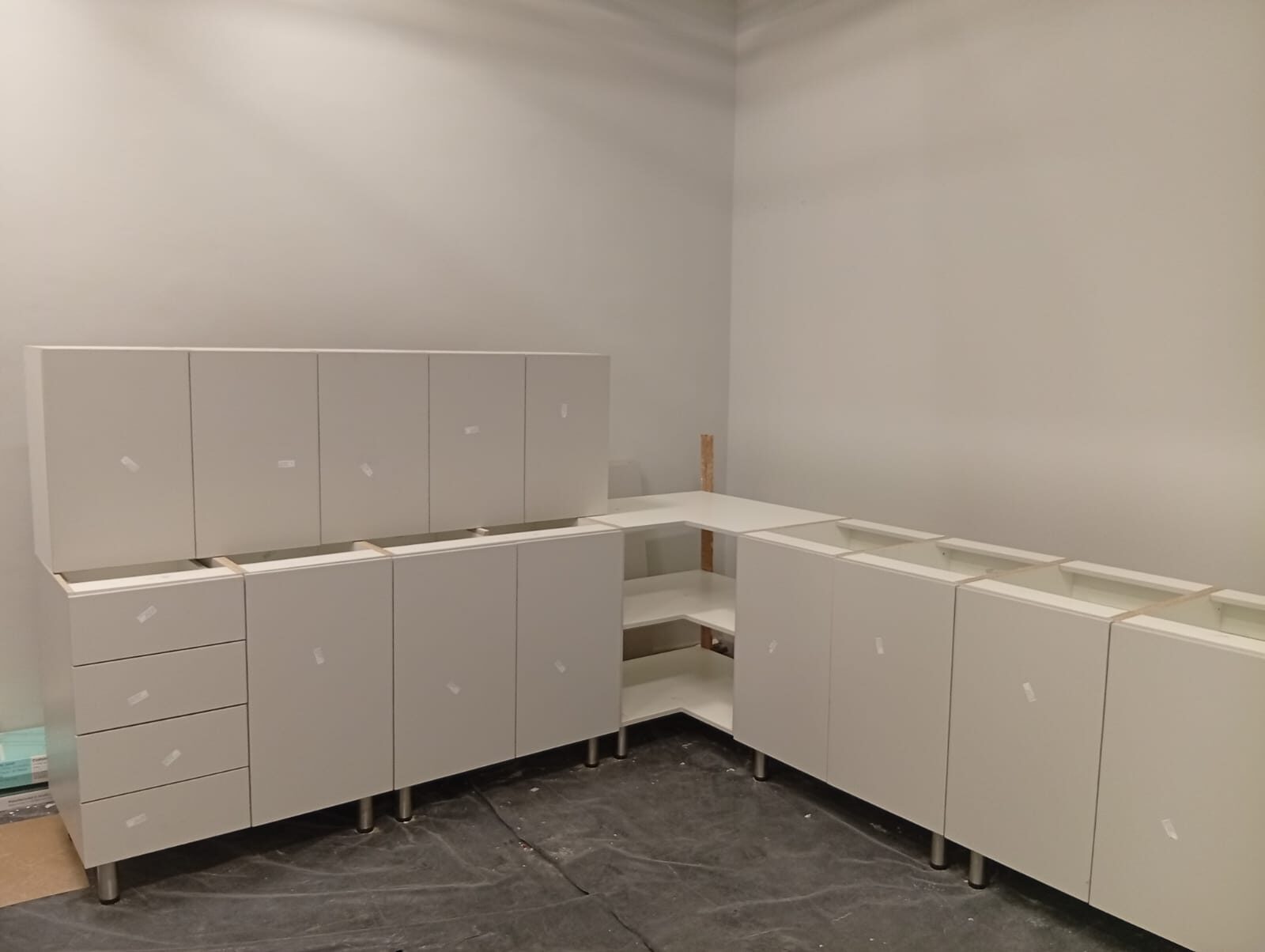 Base and wall units installed, corner shelving taking shape