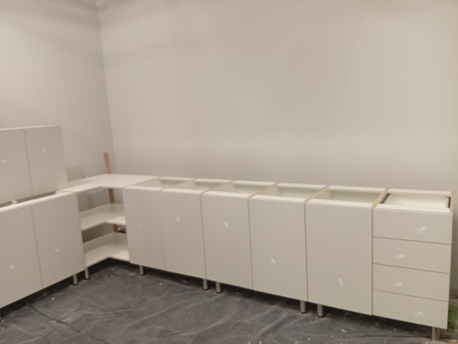 The completed run of cabinetry, doors on and ready for handover