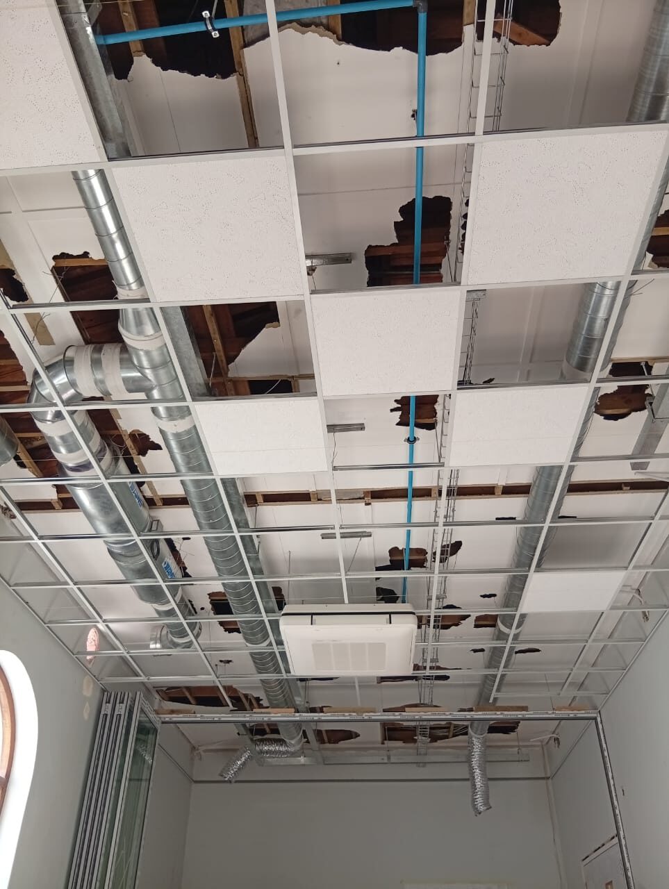 The near-complete ceiling grid with services concealed above